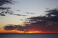 and the skies redden